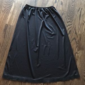 Warner’s black half slip, size XL